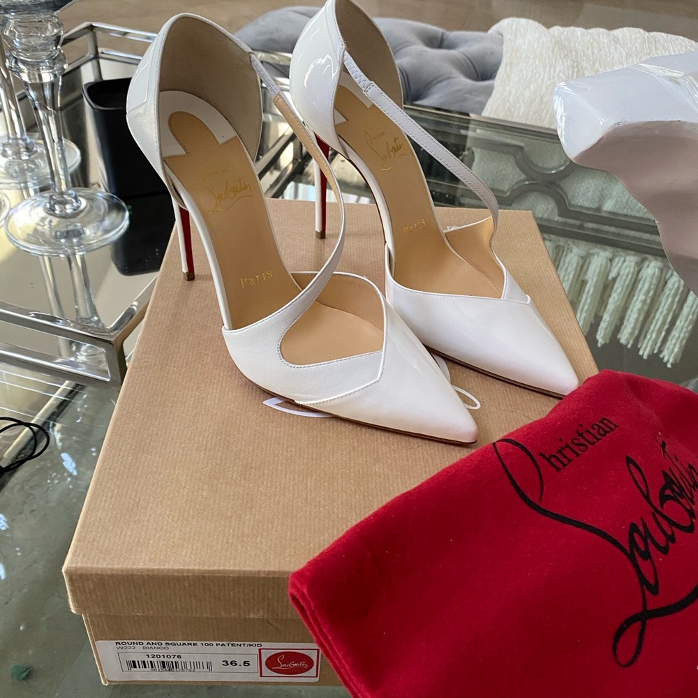 Round and square 100 patent kid white heels.